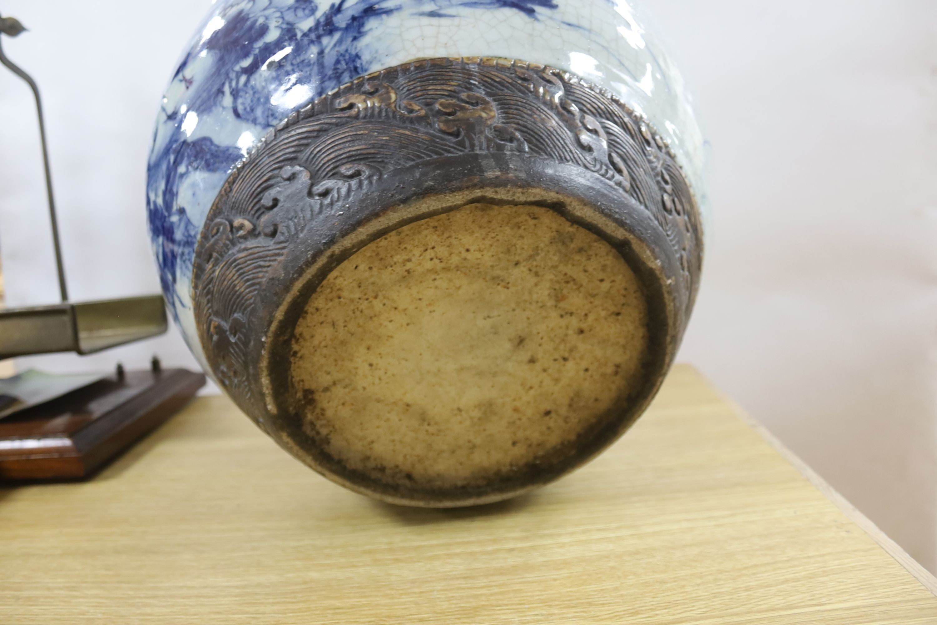A late 19th/early 20th century Chinese blue and white crackleglaze jardiniere 30cm